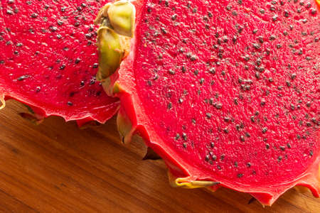 pitaya fruit slices on a wooden table.の写真素材