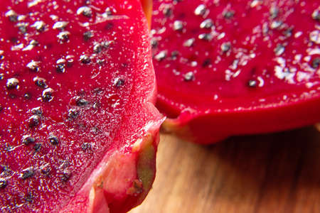 pitaya fruit slices on a wooden table.の写真素材