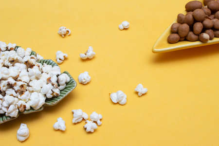 typical Brazilian June food with bowls full of popcorn, peanutsの写真素材