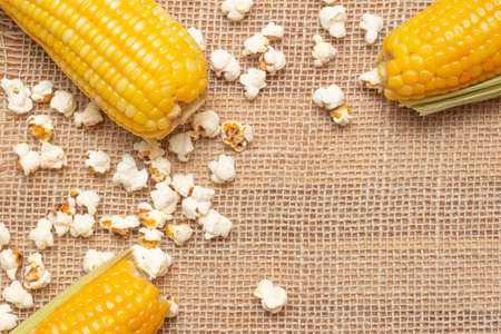 Brazilian party snacks with corn and popcorn on straw background