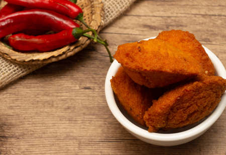 typical food from Bahia called acarajÃ© surrounded by red peppers and vatapÃ¡の写真素材