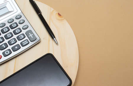 calculator and a pen on the office tableの写真素材