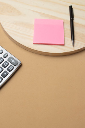 calculator and pen near notepad on desk- officeの写真素材
