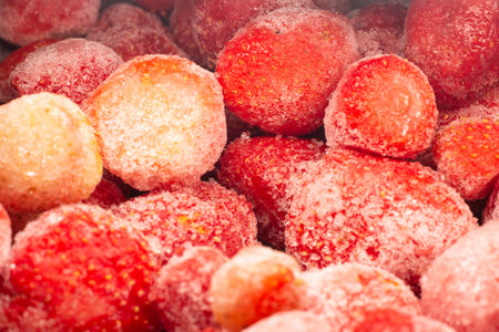 frozen strawberries in gray bowlの写真素材