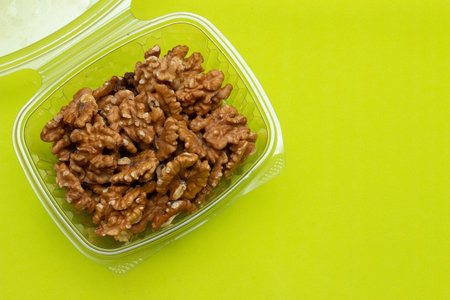 bowl full of almonds on a colored backgroundの写真素材