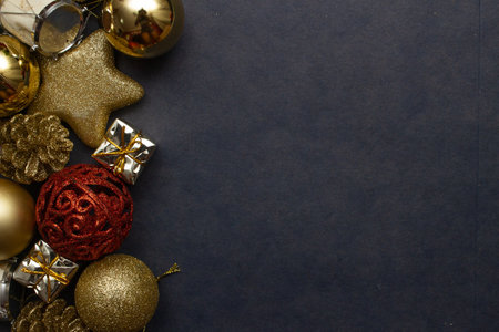 top view of gift box surrounded by christmas ornamentsの写真素材