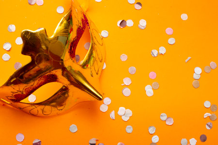 colorful carnival mask on an orange backgroundの写真素材