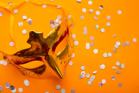 colorful carnival mask on an orange backgroundの写真素材