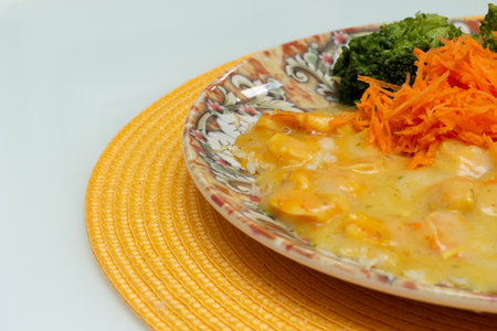 delicious cassava cream dish with shrimp, rice, broccoli and grated carrotの写真素材