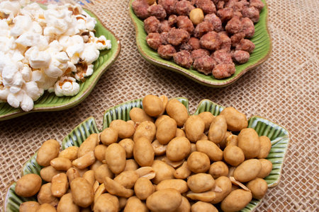 bowl full of sweet and salty peanuts and popcorn - brazilian june partyの写真素材