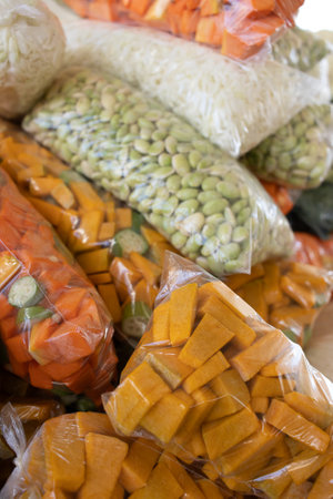 various types of vegetables cut and packaged in a transparent bagの写真素材