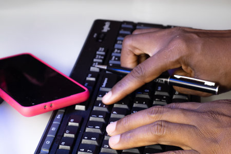 hands typing on a keyboard - technologyの写真素材