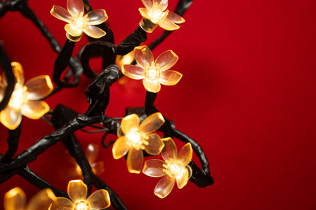 macro of a golden flower with a red background - christmas ornamentsの写真素材