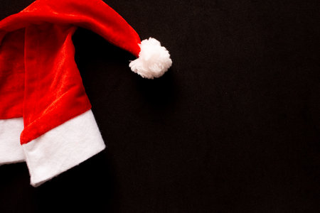 santa claus hat with black backgroundの写真素材