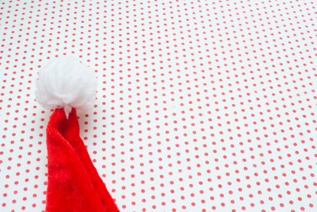 Santa Claus hat with white background and red polka dotsの写真素材