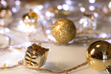 several golden Christmas ornaments and gift boxesの写真素材