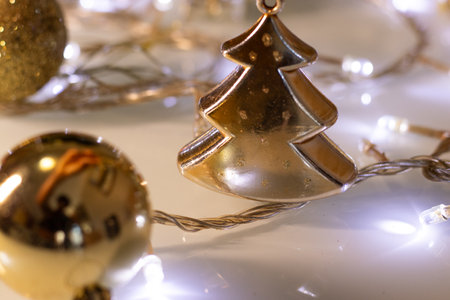 golden christmas tree and christmas lightsの写真素材
