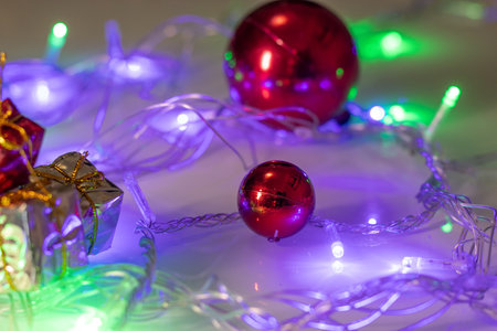 several christmas ornaments with colored lightsの写真素材