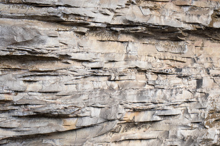 front view of rock texture in beige toneの写真素材