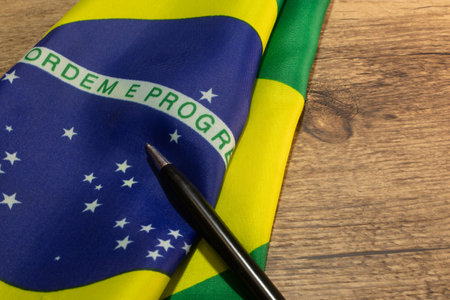 LAURO DE FREITAS, BRAZIL - April 26, 2024 : Brazilian flag with a pencilの写真素材