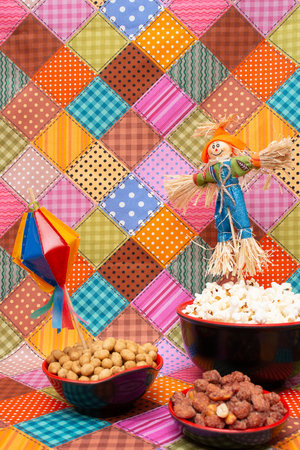 Colorful background with the image of a scarecrow and a bowl of popcornの写真素材