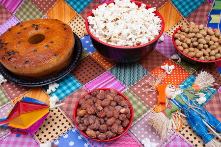 Donut with nuts and popcorn on a checkered tableclothの写真素材