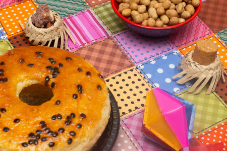 Bagel with raisins and nuts on colorful tableclothの写真素材
