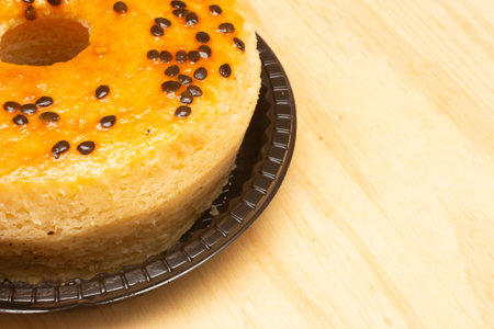 Close up of a cheesecake with chocolate chips on wooden background.の写真素材