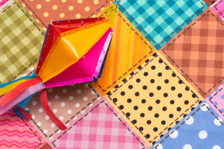 Colorful pieces of fabric on a background of checkered fabricの写真素材