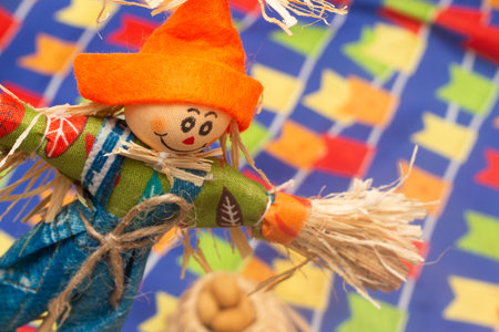 Halloween scarecrow on the background of a colorful garland.の写真素材