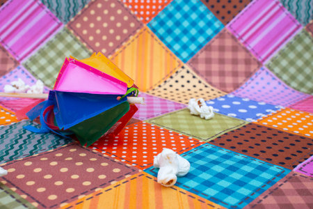 Colorful paper bags on the background of the colorful patchwork.の写真素材