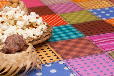 Popcorn in a basket on the tablecloth. Selective focus.の写真素材
