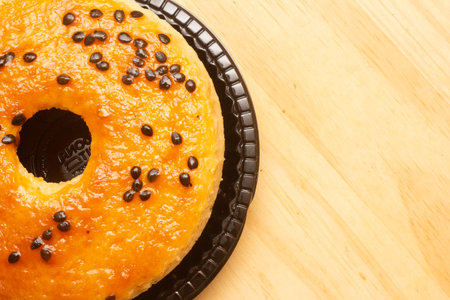 Donut with chocolate on wooden background. Top view. Copy space.の写真素材