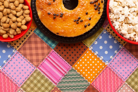 Bagel with nuts and popcorn on colorful background. Top view.の写真素材