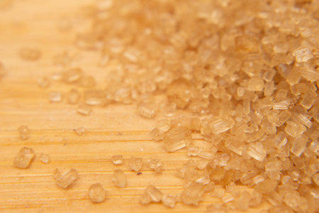 brown sugar on a wooden background, macro, close-up.の写真素材