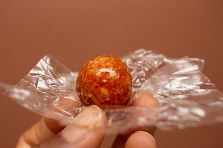 hand holding on delicious and soft caramelized coconut candyの写真素材