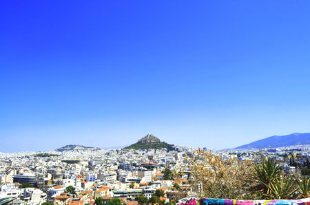 Mount Lycabettus also known as Lycabettus, Likavitos or Lykavittos under the blue sky, Athens, Greeceの写真素材