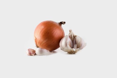 Still life of onions and garlic on white backgroundの写真素材