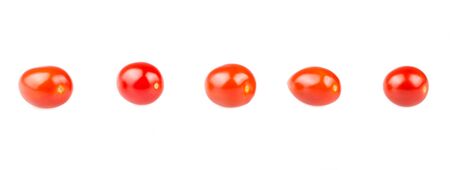 Red cherry tomatoes on white backgroundの写真素材