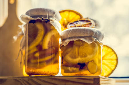 lemons arranged in jars with homemade preserves
