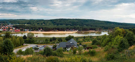 Panoramic view from the observation tower on the reservoir in KrasnobrÃ³d. Hills covered with forest. Beach by the lagoon. KrasnobrÃ³d, Polandの写真素材