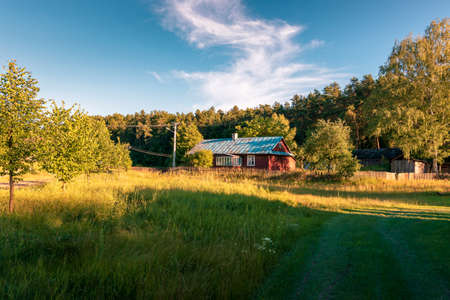 Charming old abandoned farmhouse with a blue roof. KrasnobrÃ³d, Poland