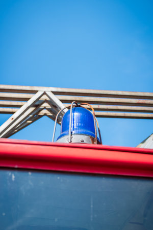 Old flashing Blue Light on a Fire Truck. Focus on the sirenの写真素材