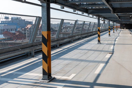 Parking on the roof of the building. Marking the columns in the parking lot. Yellow Black marks on...