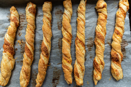 freshly baked, crispy, puff pastry sticks on. Perfect for a party.の写真素材