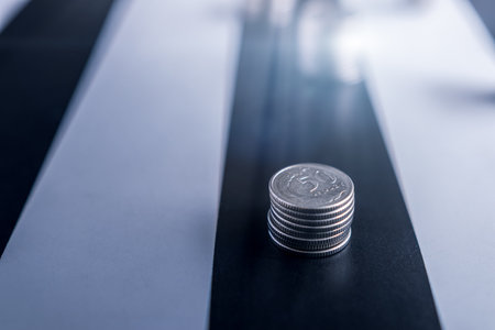 Polish coins on a black and white table. Difficult financial situation. Decreasing savings