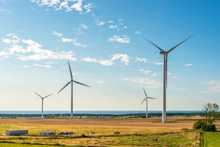A combination of beautiful nature with renewable energy sources. Wind farm on the Polish Baltic Sea.の写真素材
