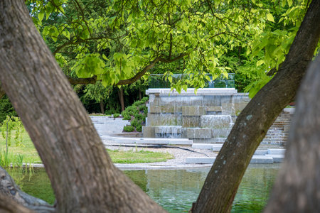Chorzow, Poland - June 20, 2023: Japanese garden in the Silesian park. A granite cascade with a waterfall and a viewpoint.のeditorial素材