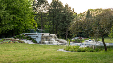 Chorzow, Poland - June 20, 2023: Japanese garden in the Silesian park. A granite cascade with a waterfall and a viewpoint.のeditorial素材