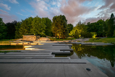 Chorzow, Poland - July 03, 2023: Japanese garden in the Silesian park in the evening. Illuminated lighting of the water cascadeのeditorial素材